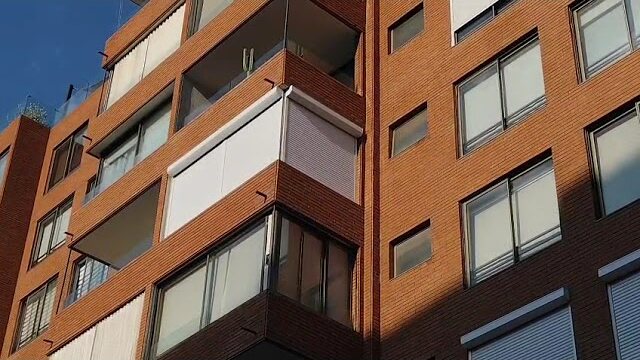 Cortinas exteriores — Motorización en la fachada de un edificio, cortinas Winsol motorizadas
